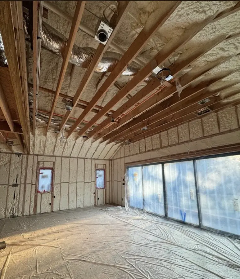Interior walls and ceiling insulated with spray foam during new construction in Jefferson